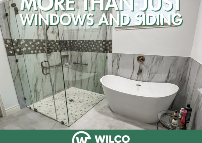 Luxurious bathroom featuring a glass shower and freestanding tub, highlighting stylish renovations by Wilco Windows & Siding.